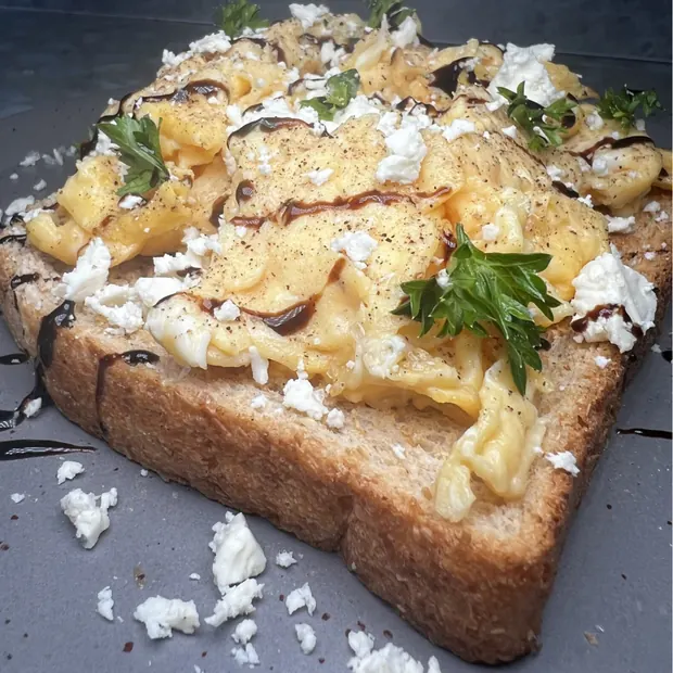 Scrambled eggs and feta on toast